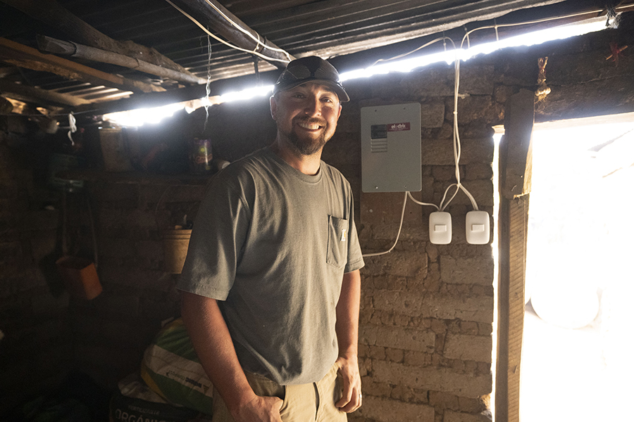 man with electrical wires in background